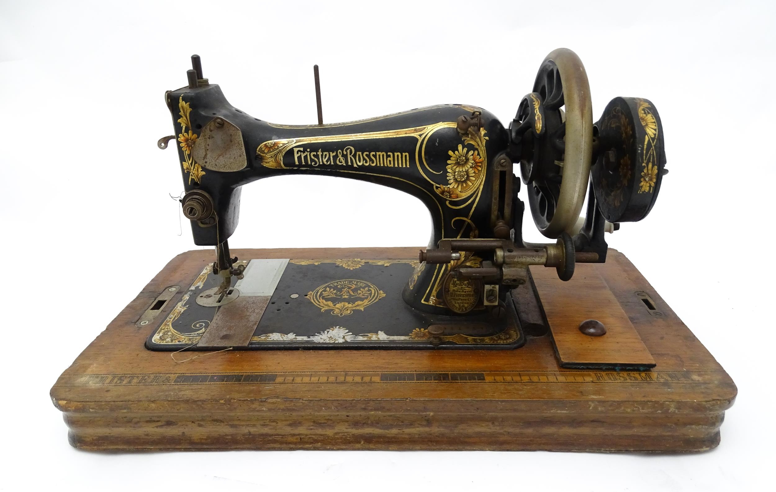 An early 20thC Frister & Rossmann hand crank sewing machine with floral and foliate decoration. - Image 3 of 15