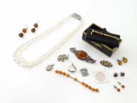 A quantity of assorted jewellery to include bead necklace, silver lockets, A Stratton hunting