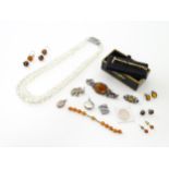 A quantity of assorted jewellery to include bead necklace, silver lockets, A Stratton hunting