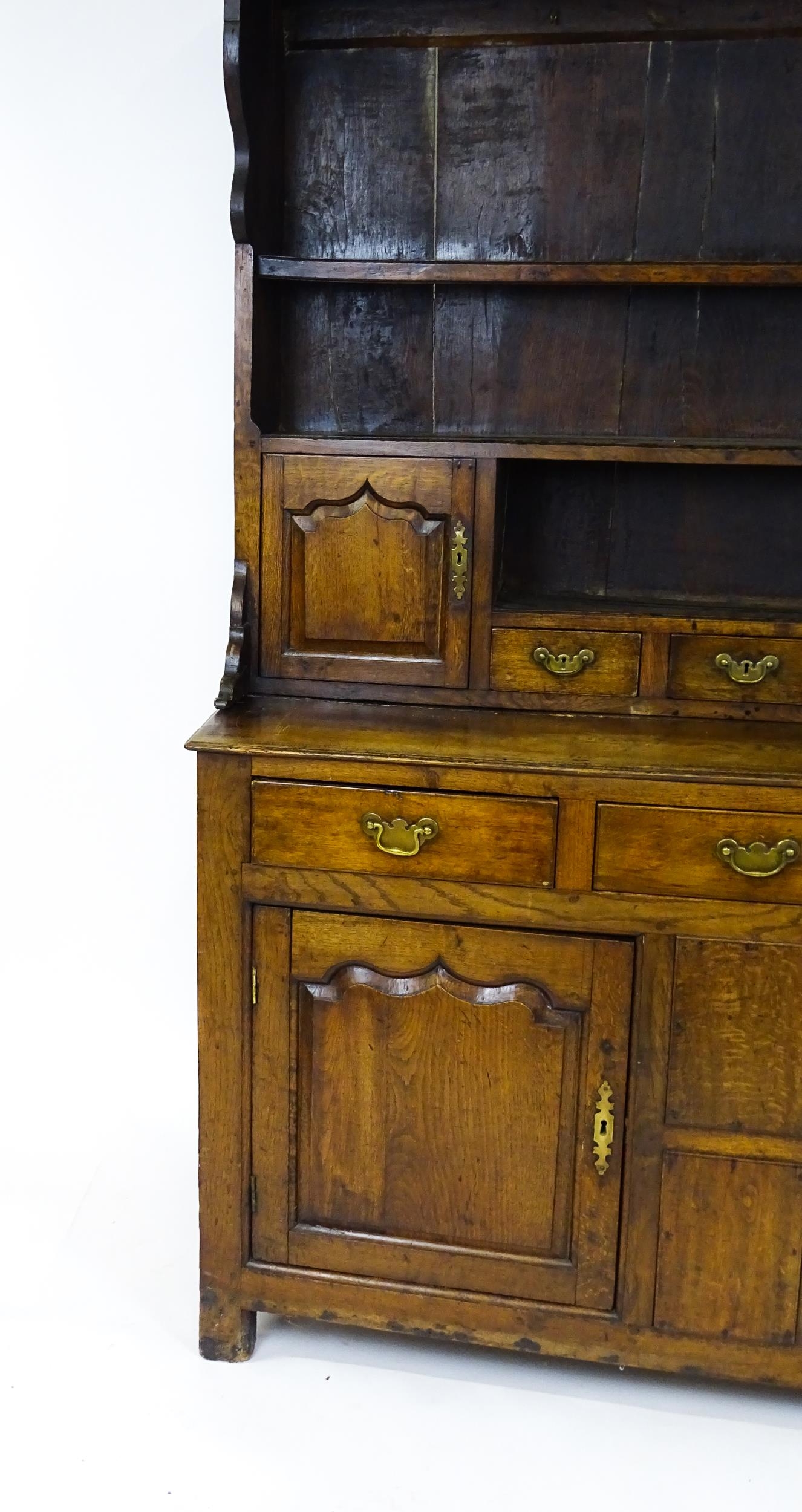 A mid 18thC oak dresser with a moulded cornice above three graduated shelves flanked by panelled - Image 5 of 9