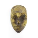 A 20thC bronze mask / plaque modelled as a face. Approx. 7 1/2" long Please Note - we do not make