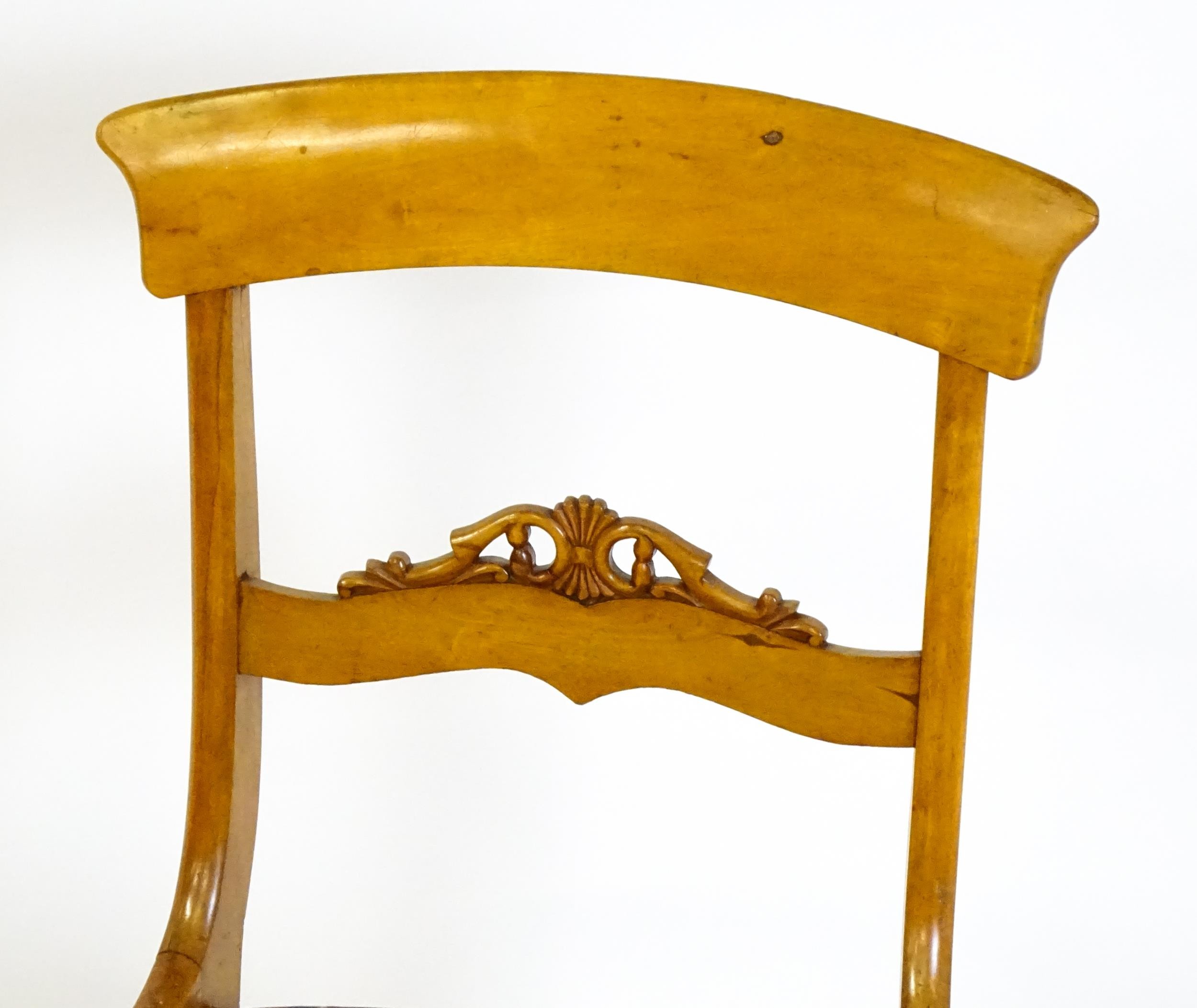 A pair of 19thC side chairs with bowed top rails, carved mid rails, drop in seats and raised on - Image 2 of 6