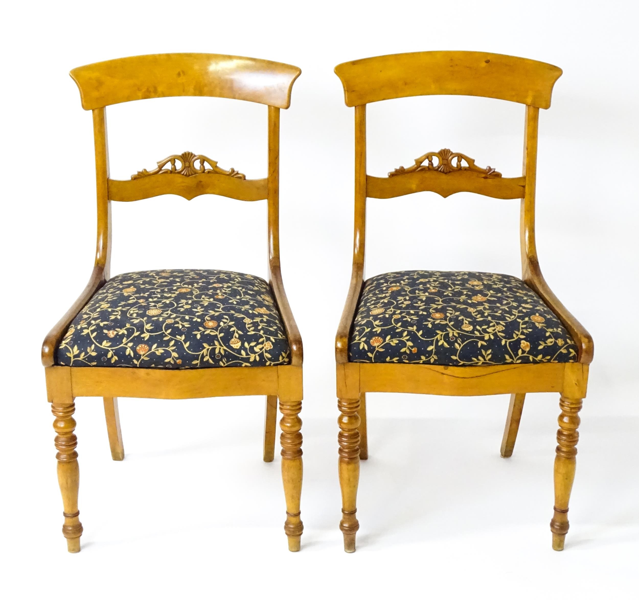 A pair of 19thC side chairs with bowed top rails, carved mid rails, drop in seats and raised on - Image 4 of 6