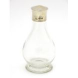 A glass private / travelling communion bottle / flask with silver screw lid, hallmarked London 1943,