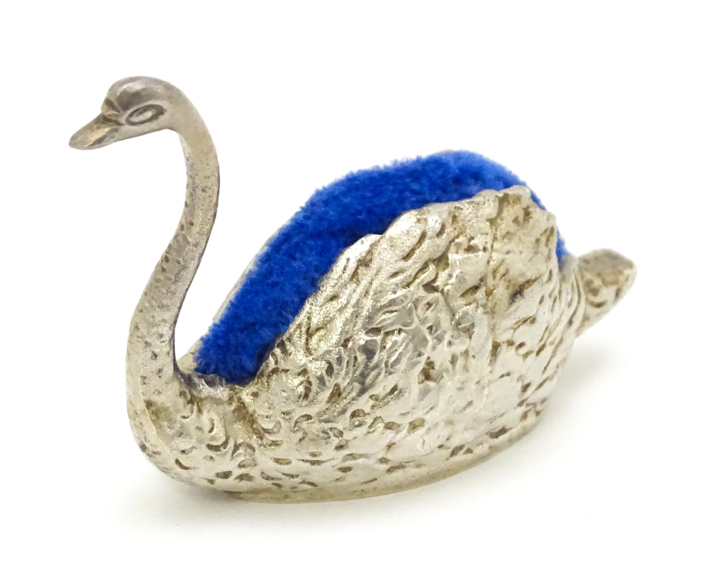 A novelty silver pin cushion of swan form, hallmarked Sheffield 1977, maker J. B. Chatterley &