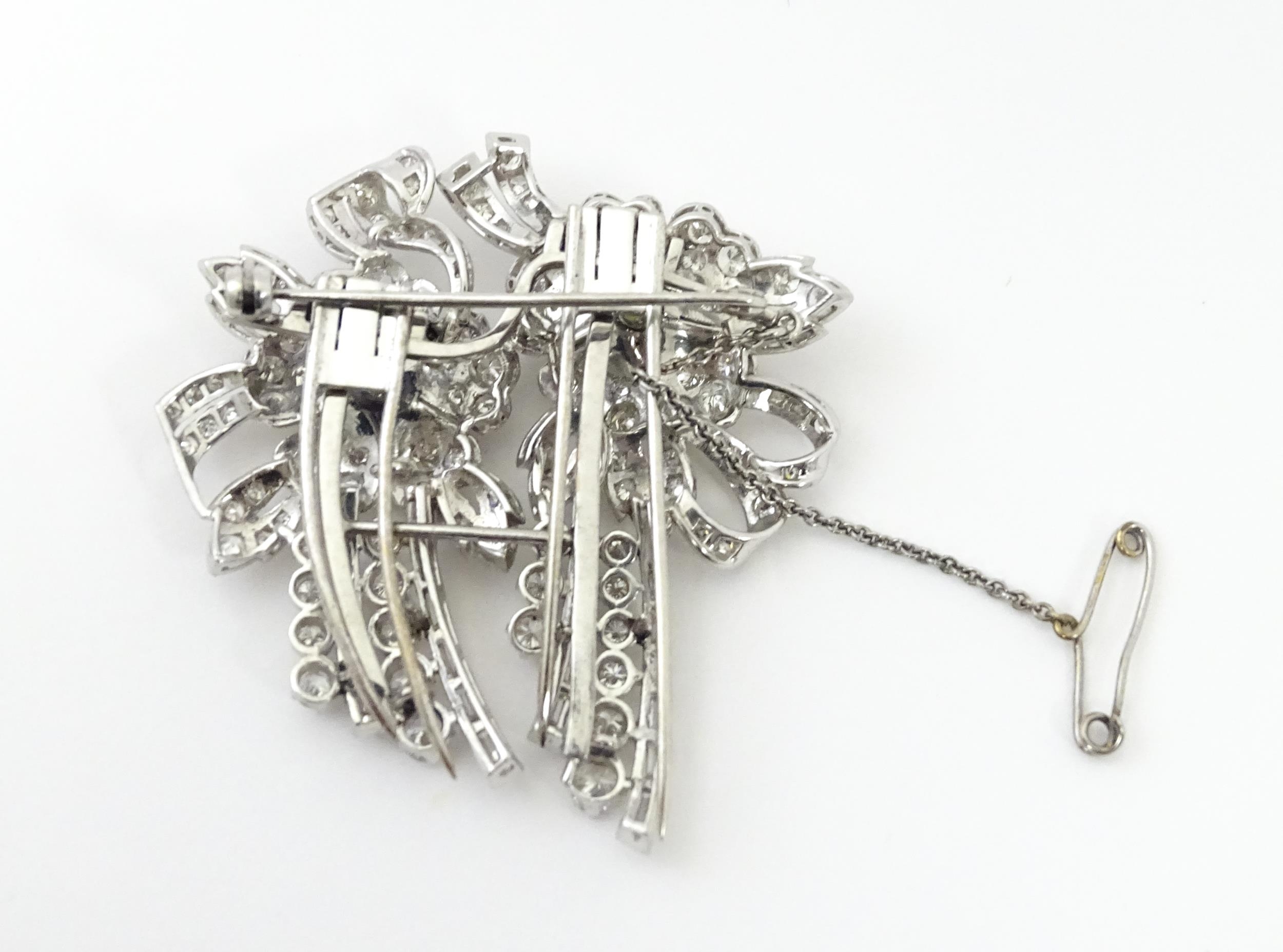 A diamond double clip brooch, the clips with flower and bow detail set with a profusion of - Image 6 of 11