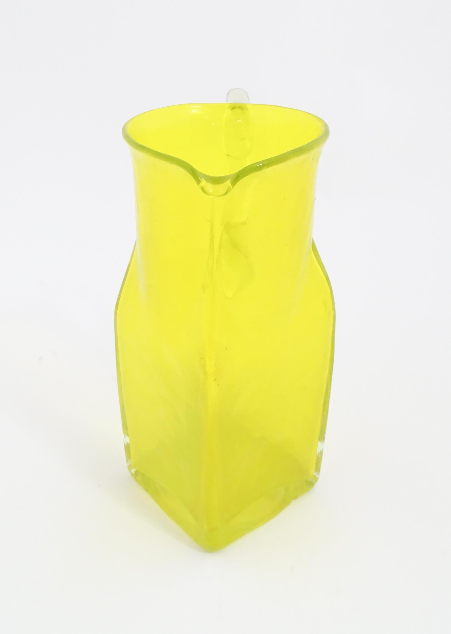 A 20thC yellow glass jug with squared base and clear glass handle. Approx. 8 1/2" high Please Note - - Image 4 of 11