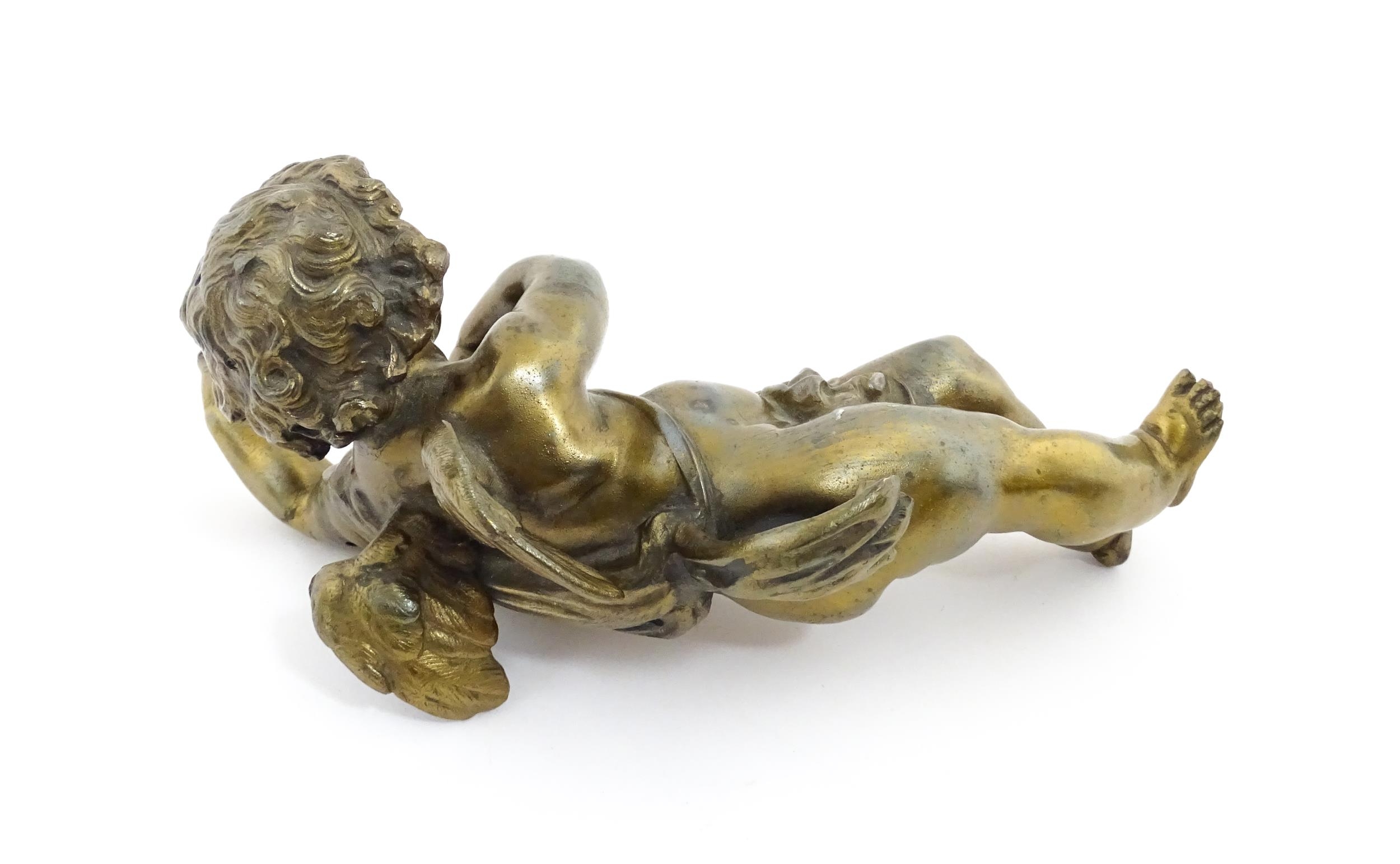 A 20thC cast model of a winged putto / cherub. Approx. 11" long Please Note - we do not make - Image 5 of 6