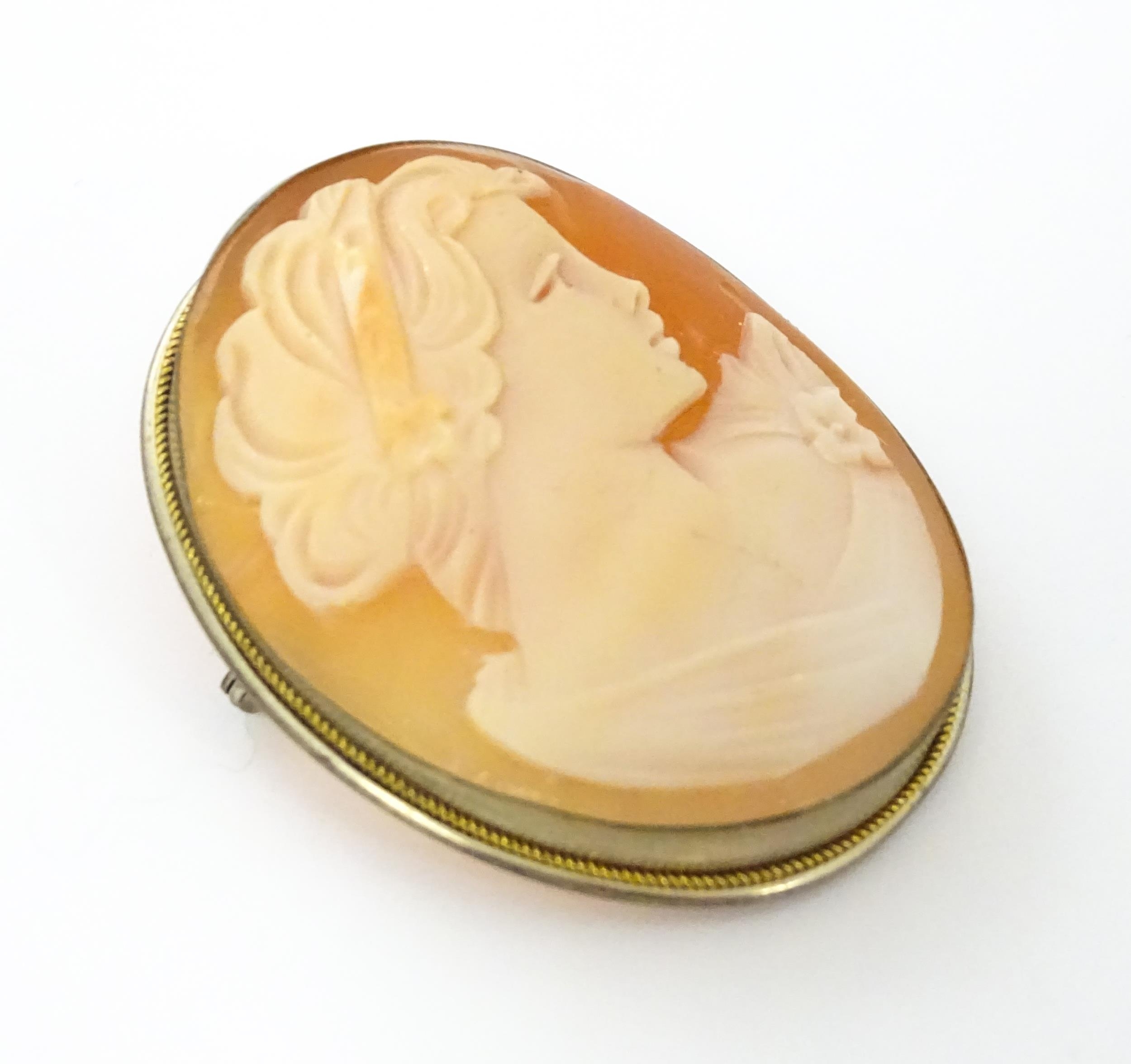 Two cameo brooches, one a classical cameo set within a .800 silver mount. The other a Victorian - Image 8 of 11