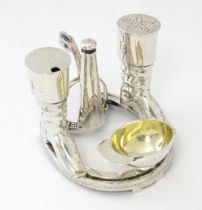 Hunting / Equestrian Interest: An Elkington & Co. silver plate novelty cruet set, the base formed as