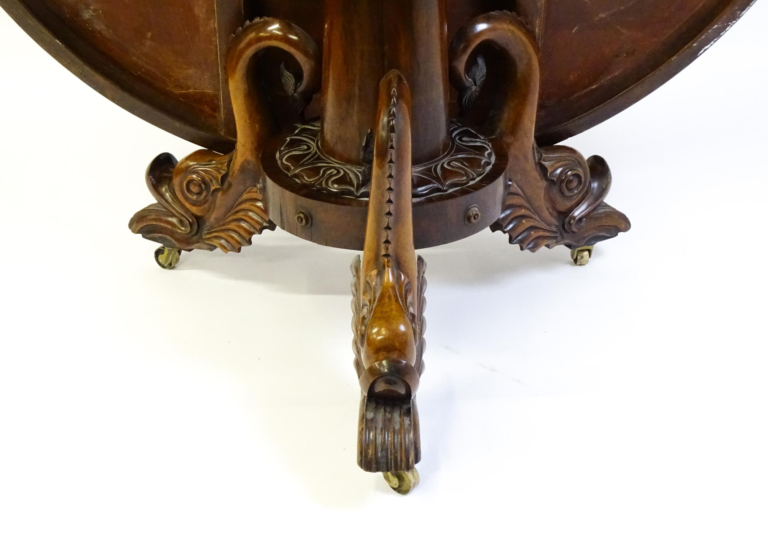 A 19thC dining table with an olive wood veneered circular top raised on a rosewood pedestal with - Image 11 of 15