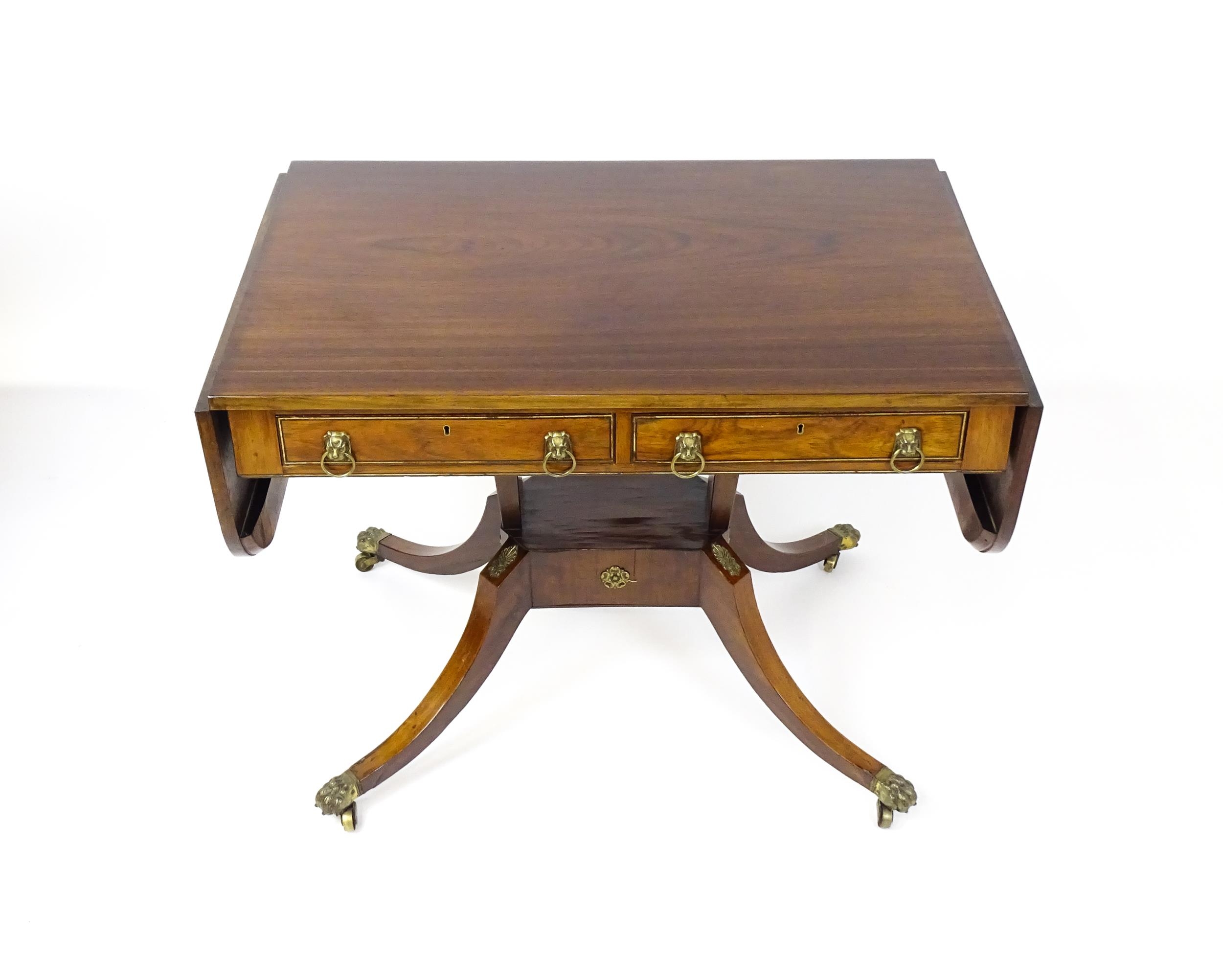 A 19thC and later sofa table with drop flaps to either side, two small frieze drawers opposing two - Image 4 of 10