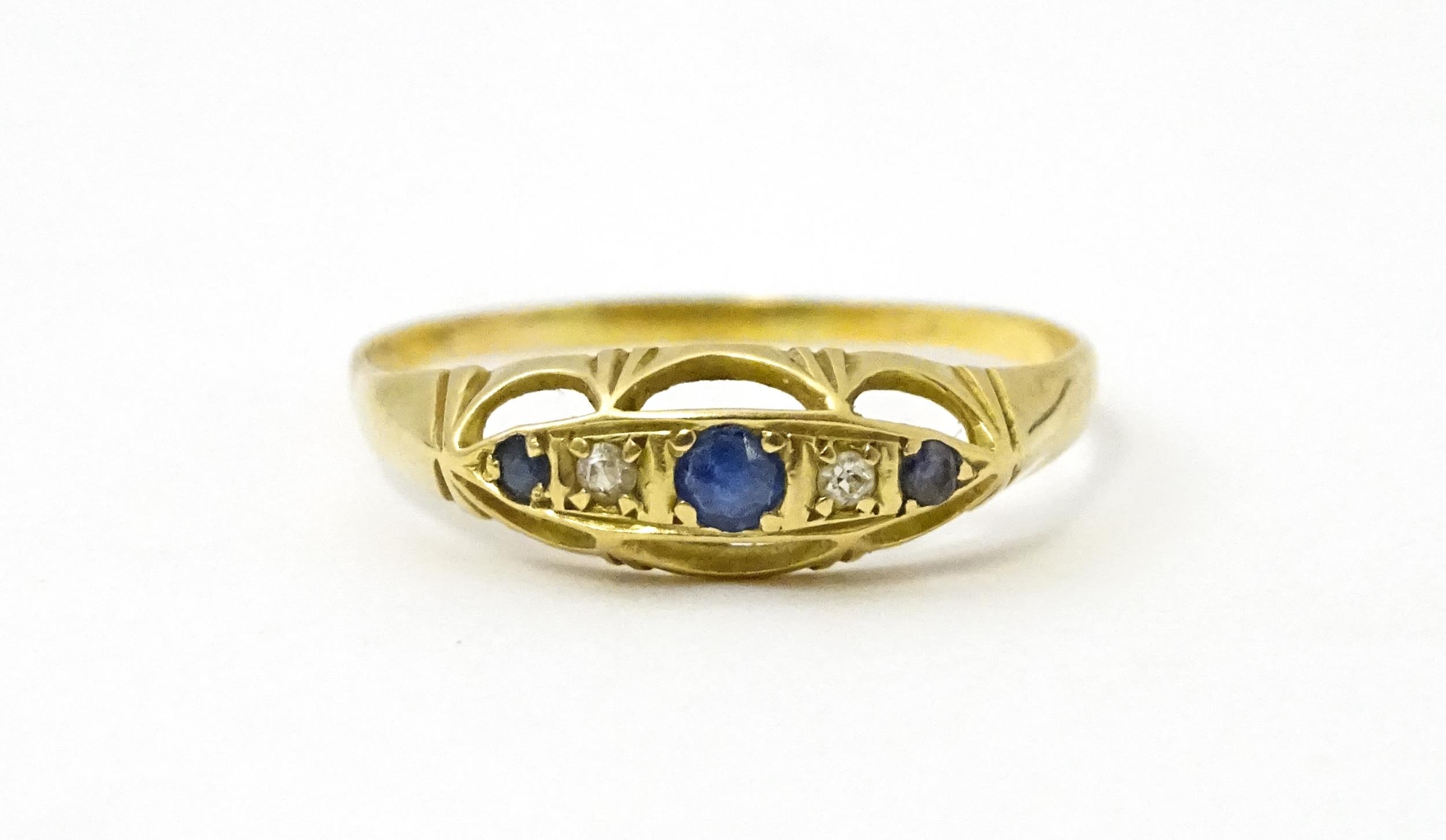 A gold ring set with diamonds and sapphires. Ring size approx. X Please Note - we do not make - Image 2 of 6