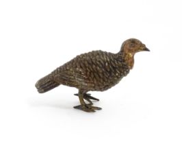 A cold painted bronze model of a game bird. Approx. 1 3/4" long Please Note - we do not make