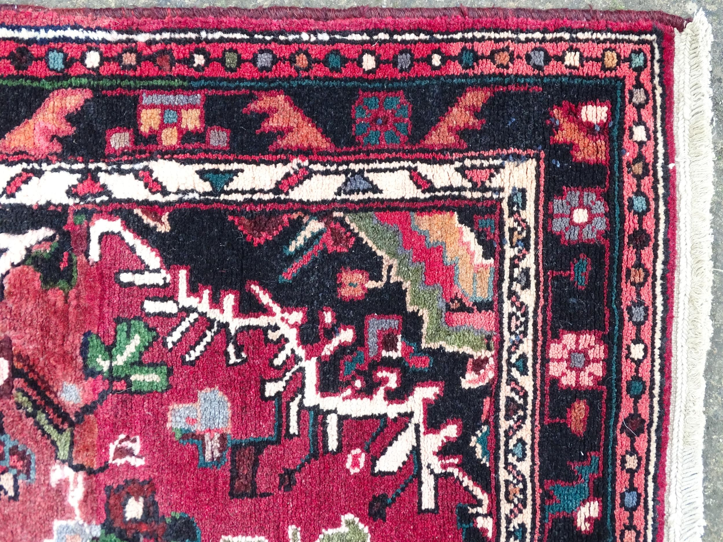 Carpet / Rug : A Persian Hamadan runner, the red ground with central cream ground medallion with - Image 5 of 8