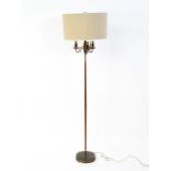 A 20thC three branch standard lamp. Approx. 62 1/2" high Please Note - we do not make reference to