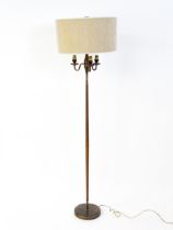 A 20thC three branch standard lamp. Approx. 62 1/2" high Please Note - we do not make reference to