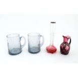 A pair of glass mugs / tankards together with an Art Nouveau cranberry to clear glass bud vase