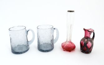A pair of glass mugs / tankards together with an Art Nouveau cranberry to clear glass bud vase