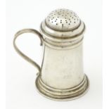 An American sterling silver pepperette modelled as a flour shaker. Marked under Georg Jensen Inc,