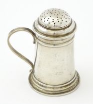 An American sterling silver pepperette modelled as a flour shaker. Marked under Georg Jensen Inc,