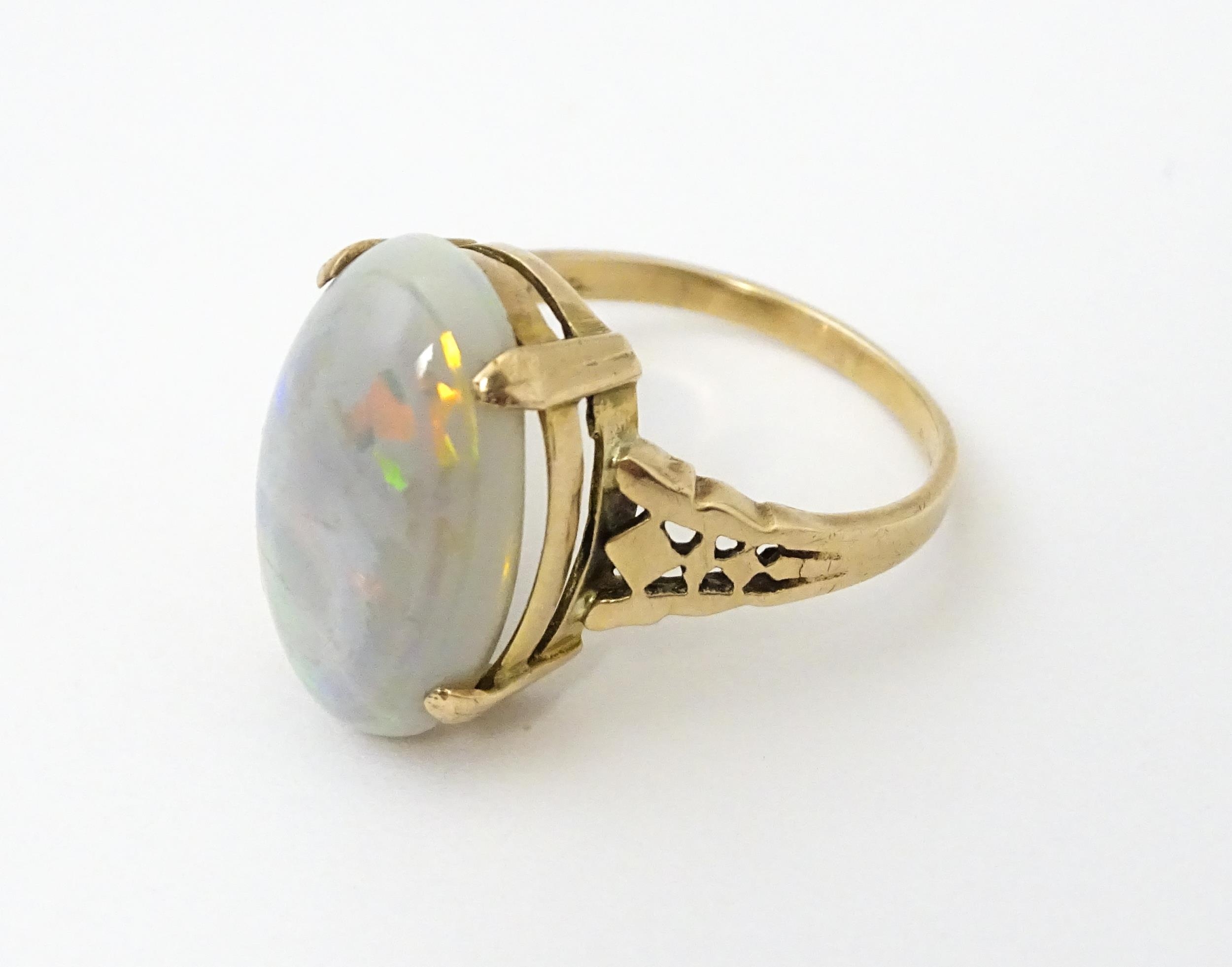 A 9ct gold ring set with large opal cabochon. The opal approx 3/4" long. Ring size approx. 0 - Image 5 of 10