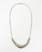 A silver necklace with silver gilt detail set with diamonds. Approx 18" long Please Note - we do not