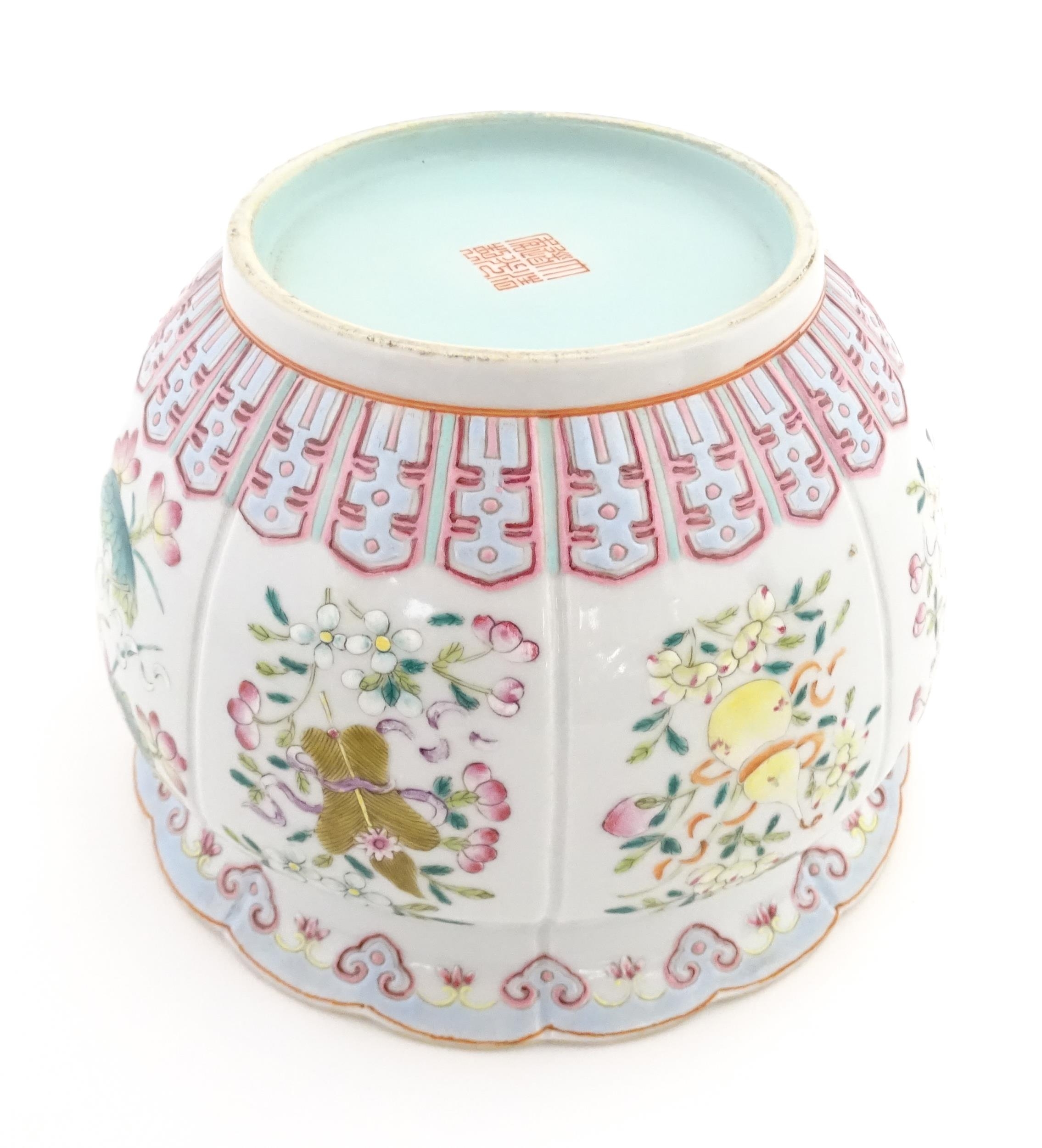 A Chinese famille rose bowl with scalloped edge decorated with flowers, foliage and scrolls. - Image 2 of 8