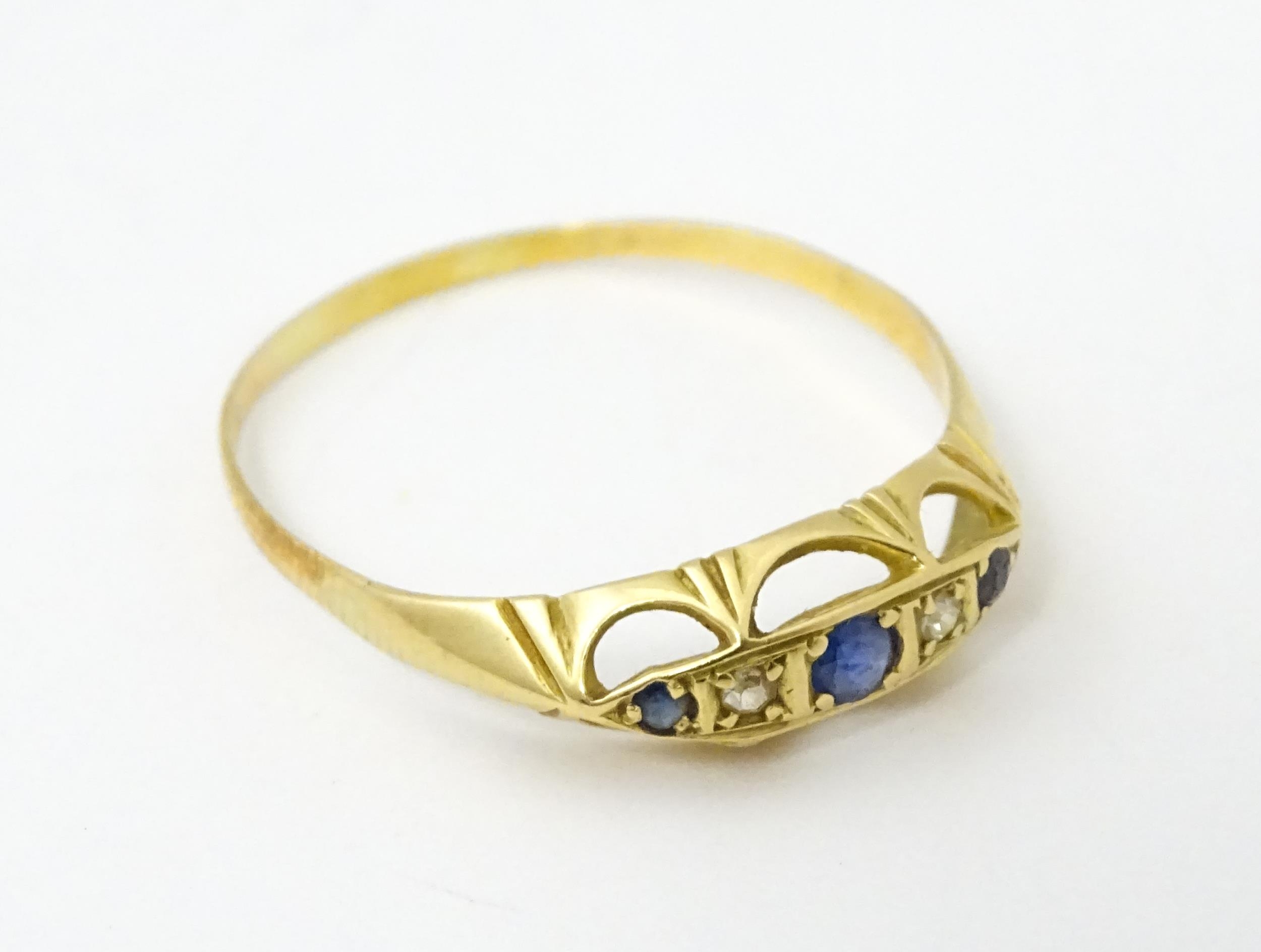 A gold ring set with diamonds and sapphires. Ring size approx. X Please Note - we do not make - Image 4 of 6