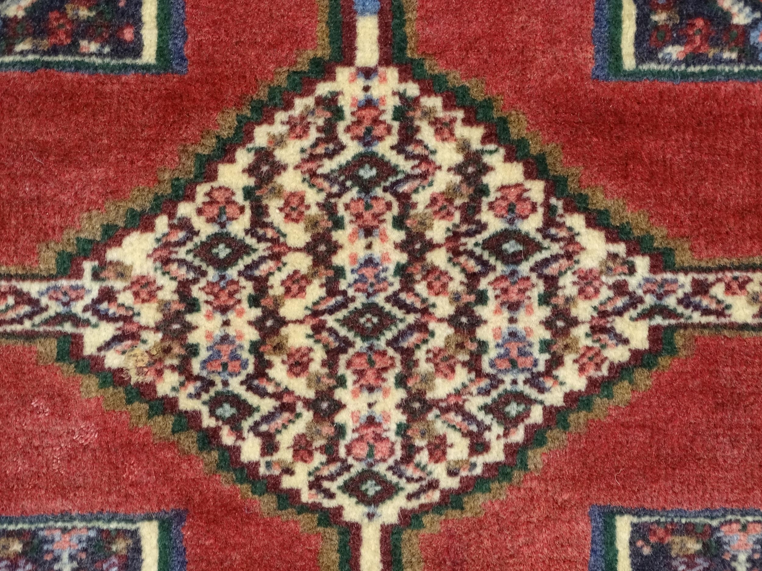 Carpet / Rug : A North West Persian Senneh runner with a red ground decorated with central repeating - Image 8 of 9