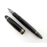 A Mont Blanc Meisterstuck 146 fountain pen, with black barrel and cap, 14k gold nib, approx 5 6/8"