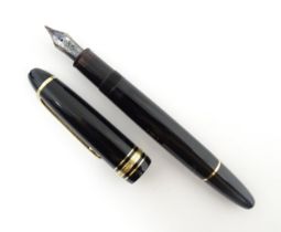 A Mont Blanc Meisterstuck 146 fountain pen, with black barrel and cap, 14k gold nib, approx 5 6/8"