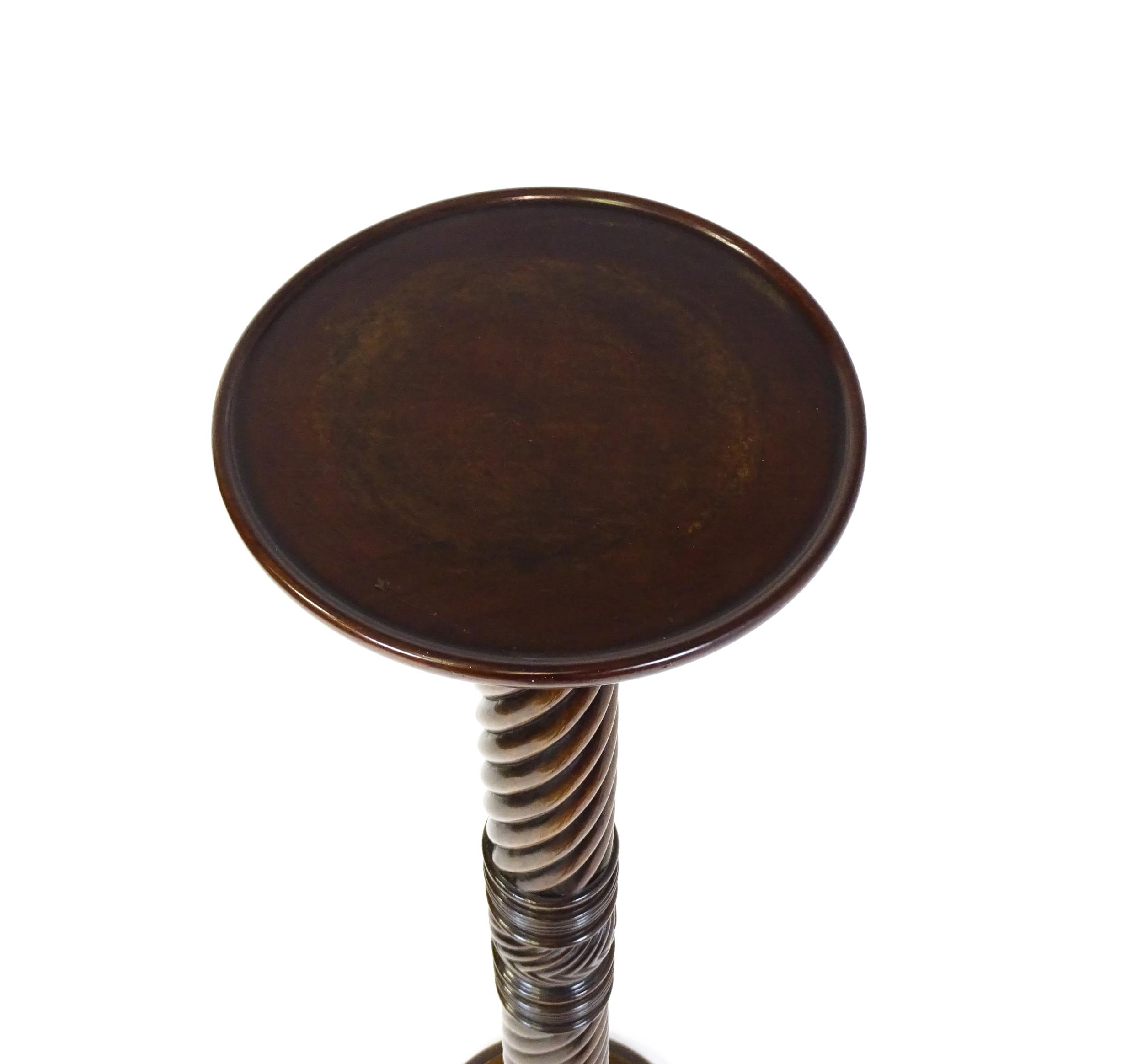 A Victorian mahogany torchiere / jardinière stand with a twist turned pedestal with carved - Image 7 of 7
