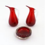 Two Whitefriars ruby glass jugs. Together with a studio glass bowl with controlled bubble detail .