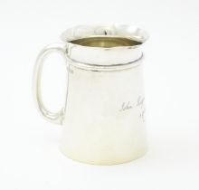 A silver Christening mug hallmarked Sheffield 1906, maker Mappin & Webb. Approx. 3 1/2" high