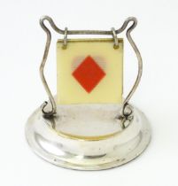 A silver plate trump card / suit indicator marker. Approx 2" high Please Note - we do not make