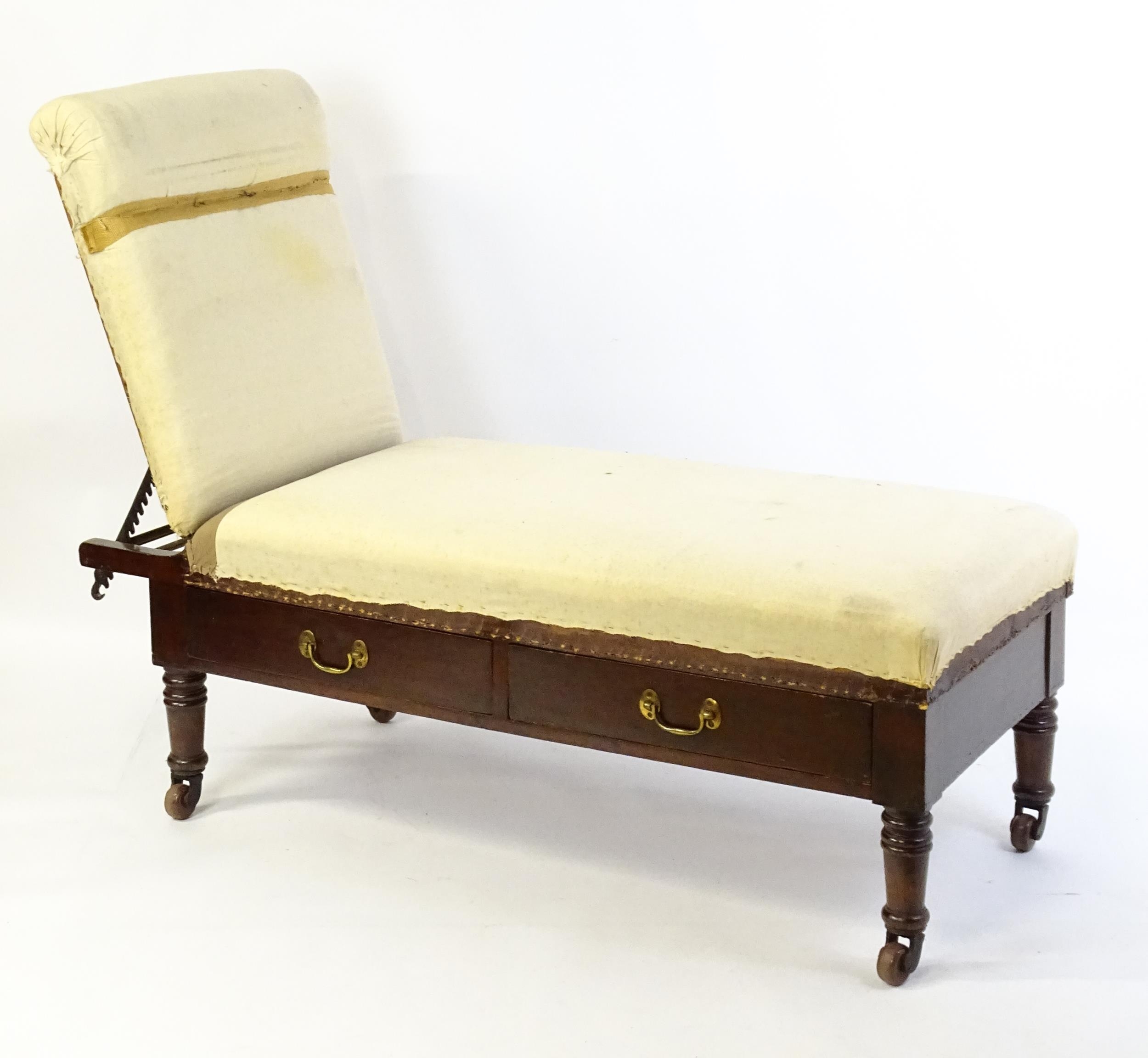 A Victorian 'Carters Literary Machine' day bed with an adjustable backrest above two short drawers