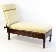 A Victorian 'Carters Literary Machine' day bed with an adjustable backrest above two short drawers