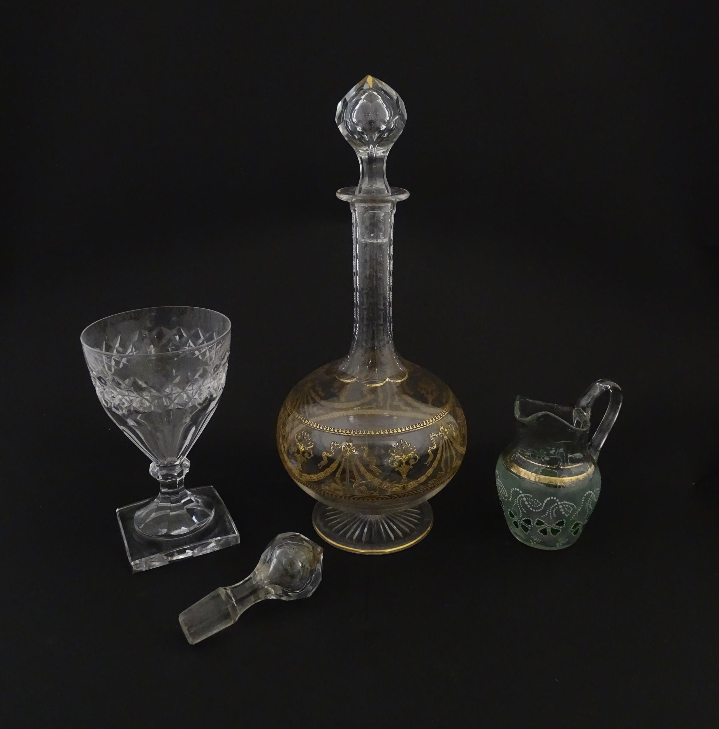 Three items of glassware comprising a Val Saint Lambert glass with squared foot, a decanter with