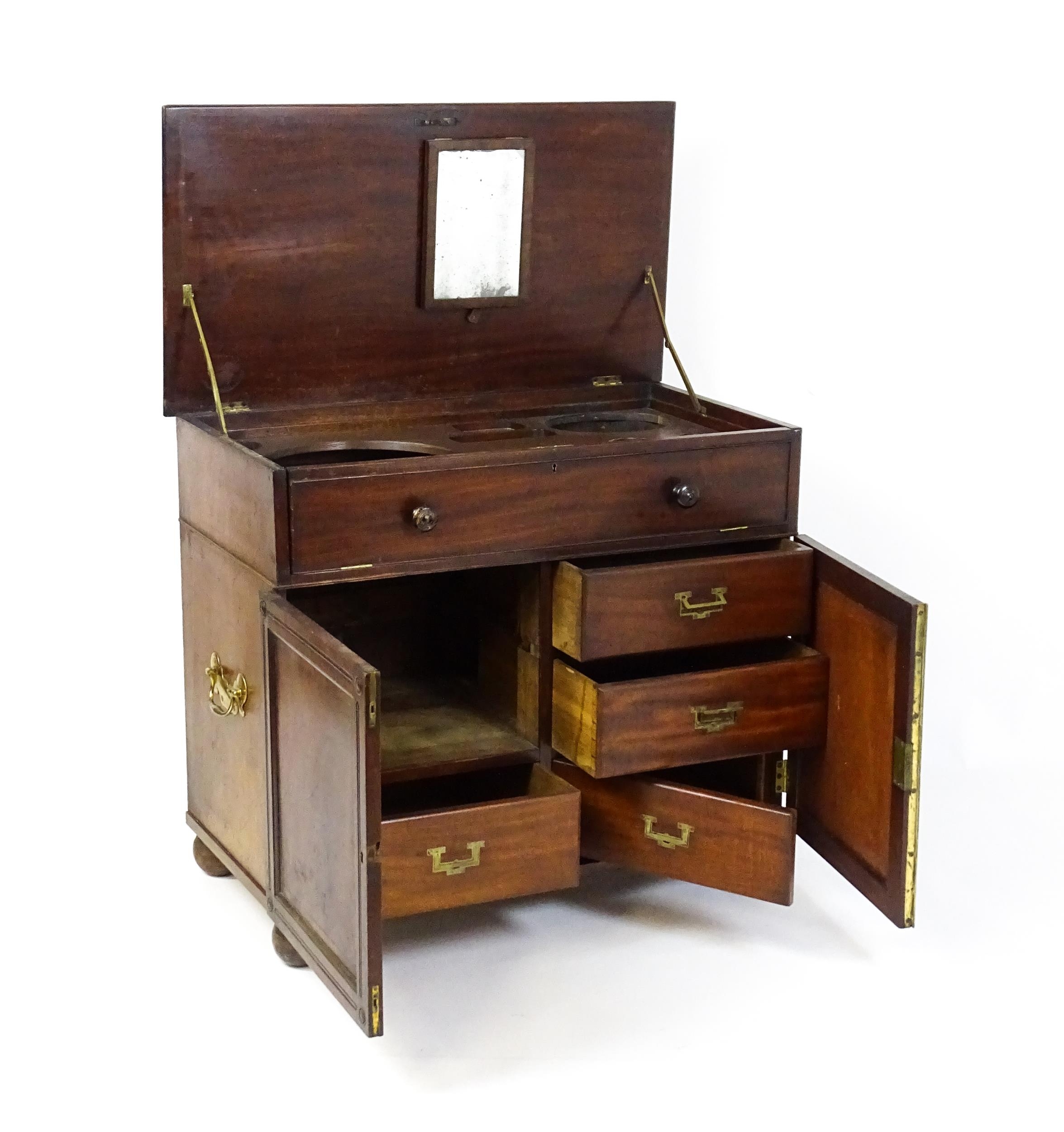 A Georgian mahogany campaign washstand with a mirror to the interior and sections for internal - Image 4 of 11