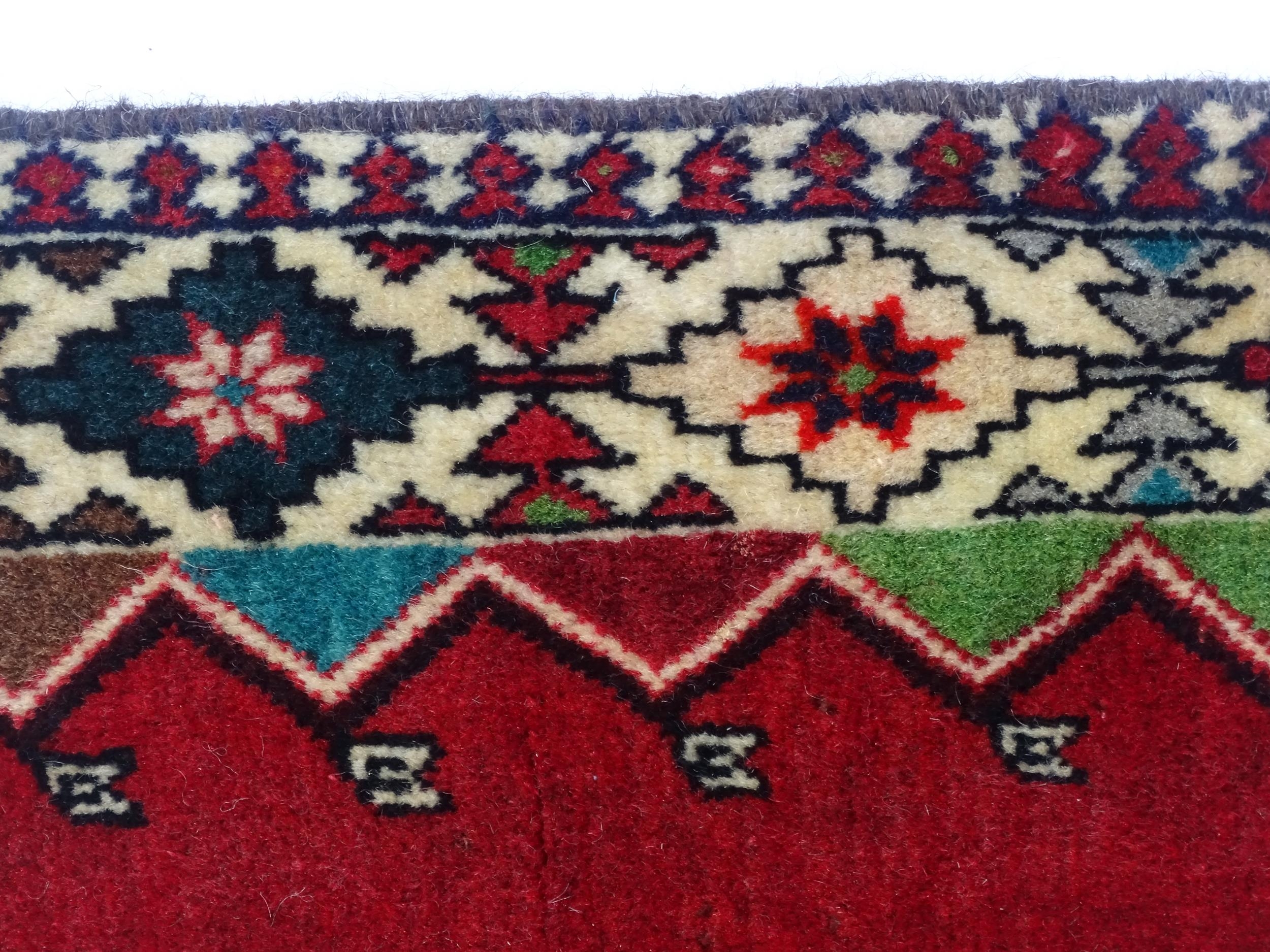 Carpet / Rug: A South West Persian Qashqai rug the red ground decorated with geometric motifs. - Image 5 of 9