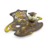 An Art Nouveau / Jugendstil cast standish of shaped form with enamel waterlily and lotus flower