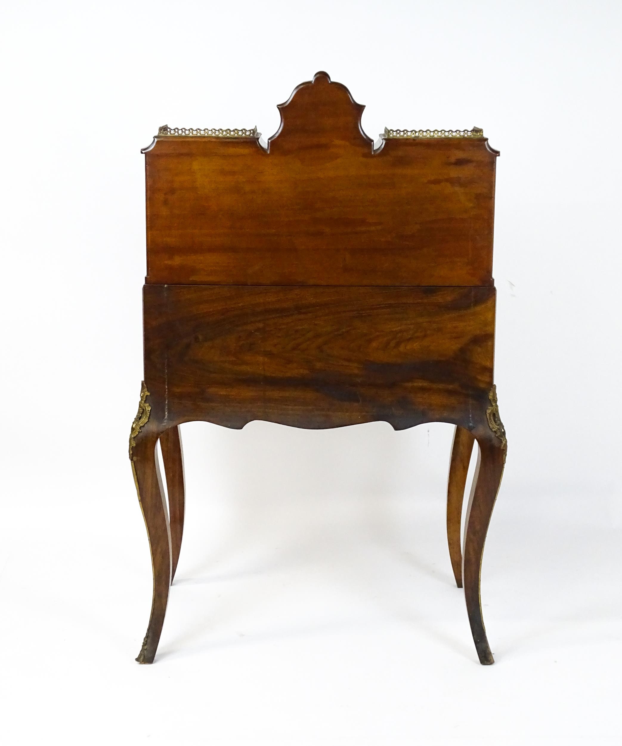 A 19thC burr walnut Bonheur du jour with a mirrored back stand and flanked by two glazed cabinets - Image 11 of 11