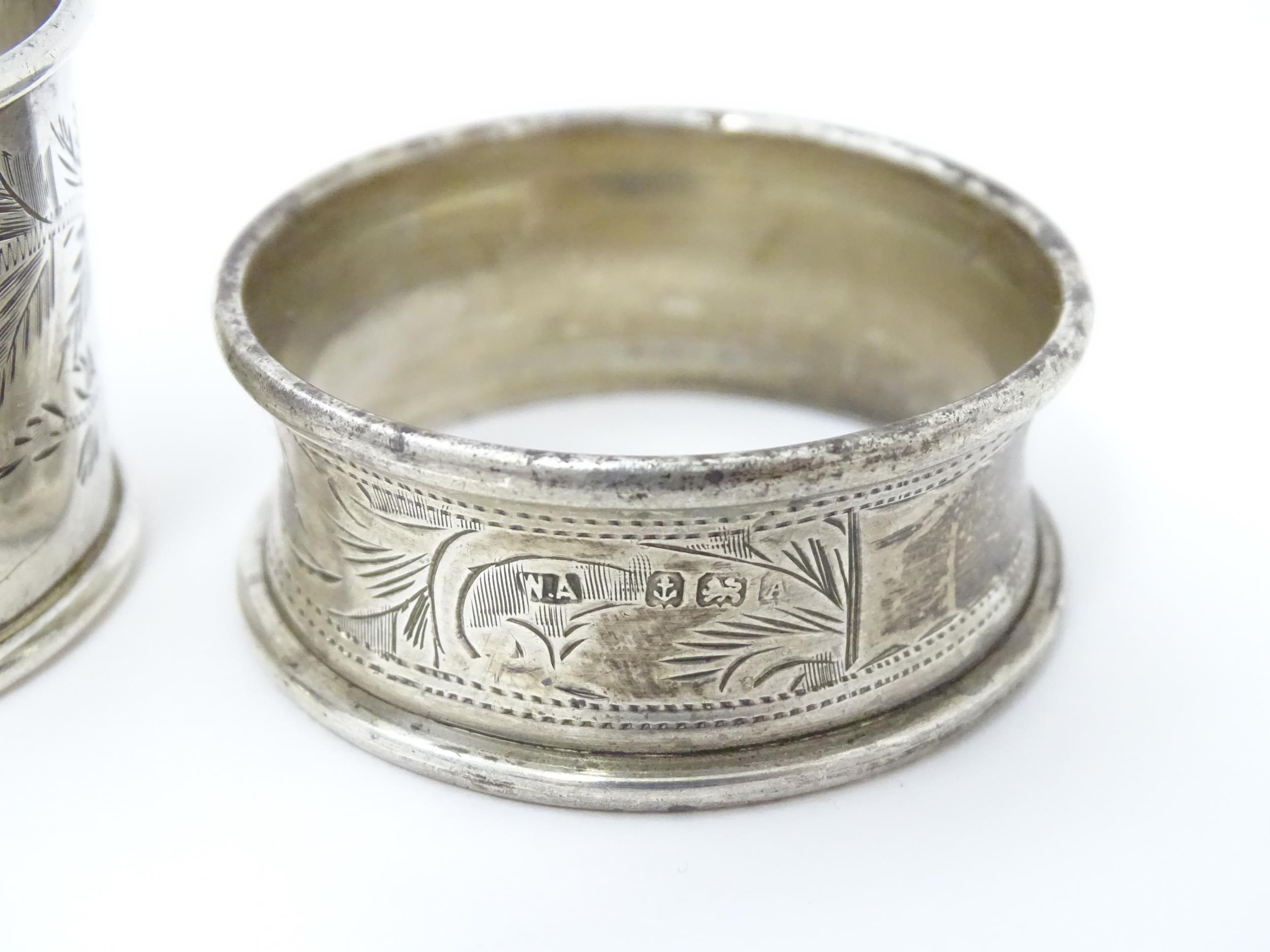 Two silver napkin rings with engraved foliate decoration, one hallmarked Birmingham 1928 maker - Image 6 of 8