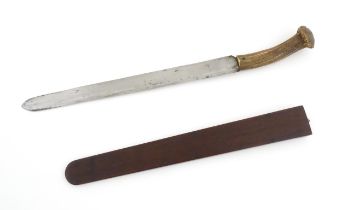 Kitchenalia : an early 20thC butcher's slicing knife, with antler handle, steel blade and wooden