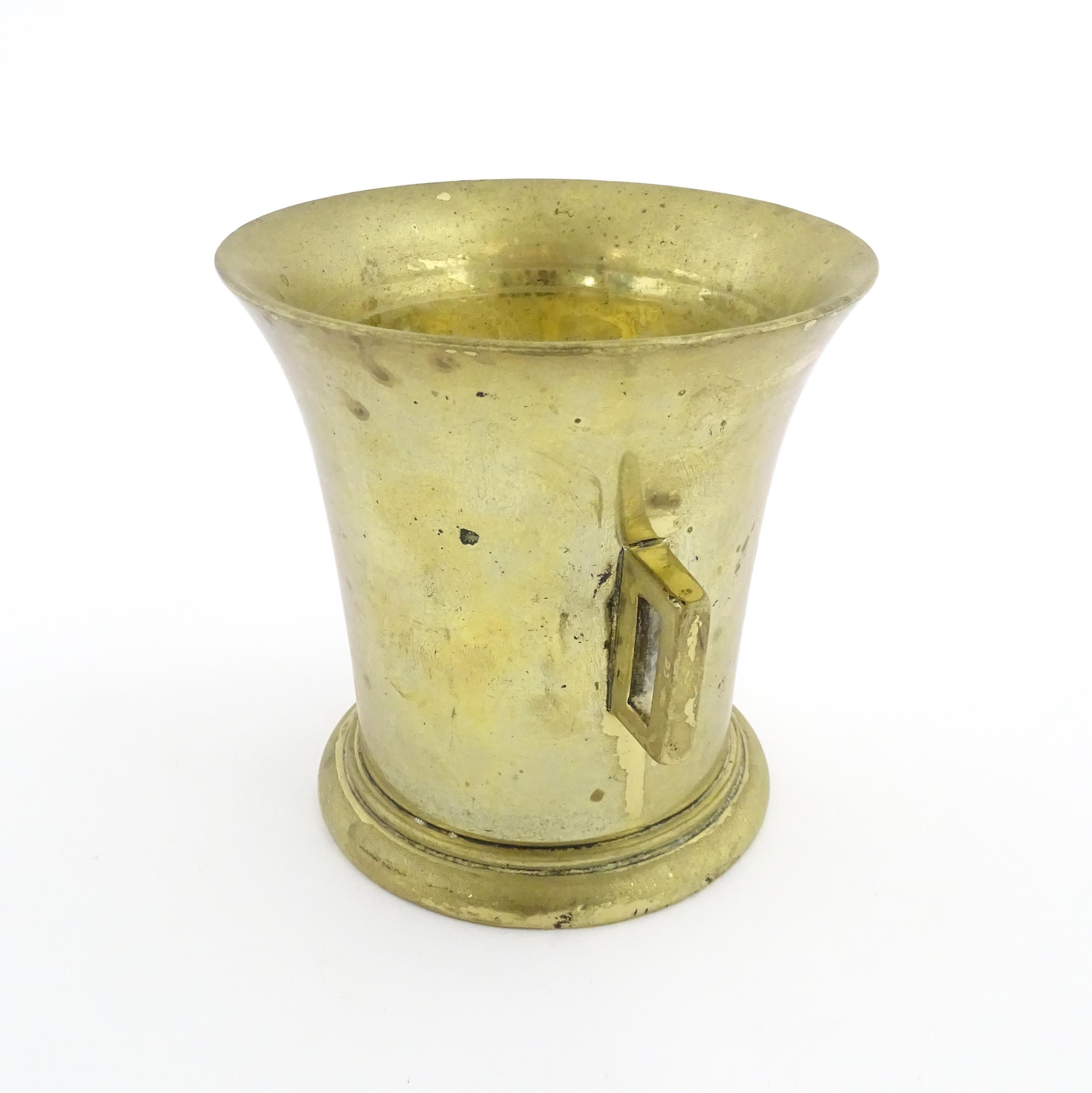 A 19thC brass pestle and mortar, the mortar of tapering form with twin rectangular handles. Mortar - Image 6 of 14
