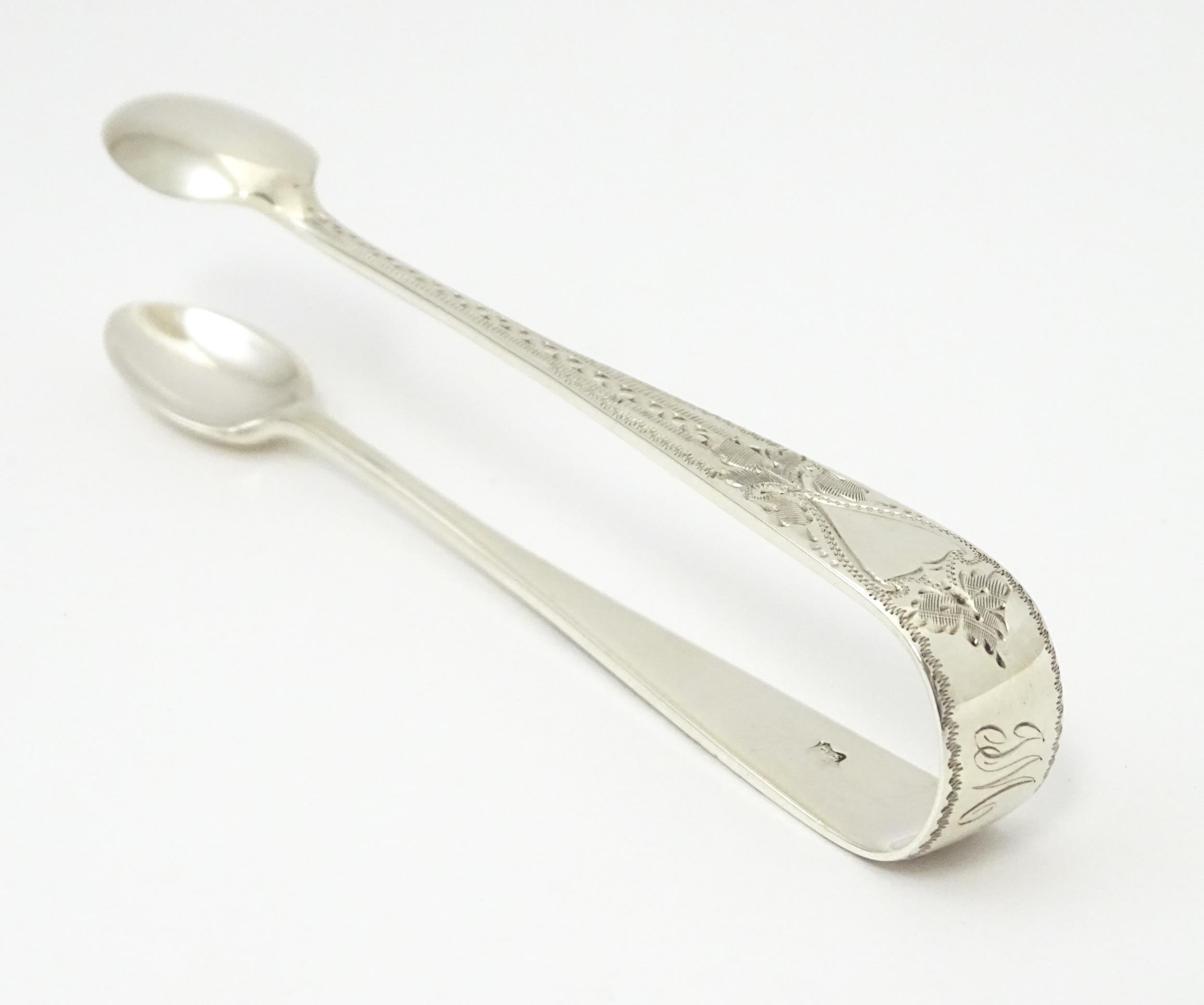 Silver sugar tongs with bright cut engraved decoration Hallmarked London 1901 maker Josiah - Image 8 of 8