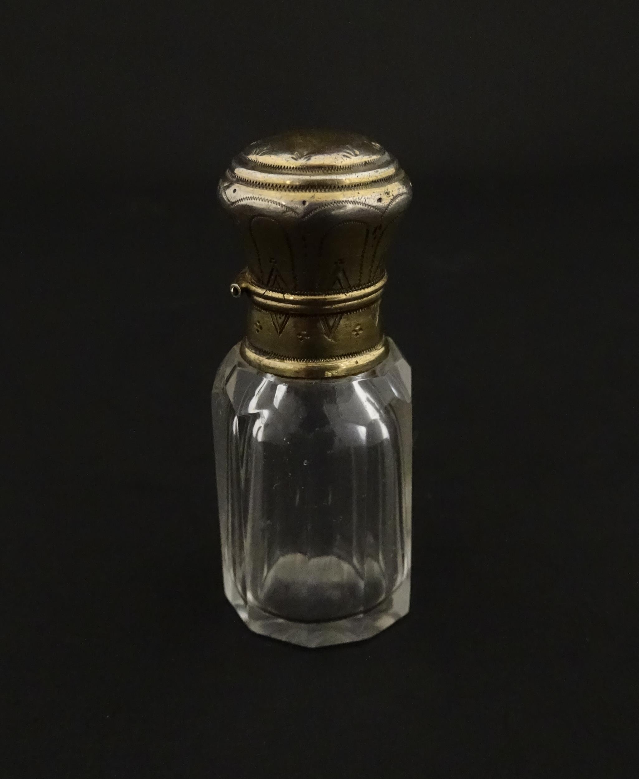 A French scent / perfume bottle with silver gilt top. Approx. 2 1/4" high Please Note - we do not - Image 3 of 10