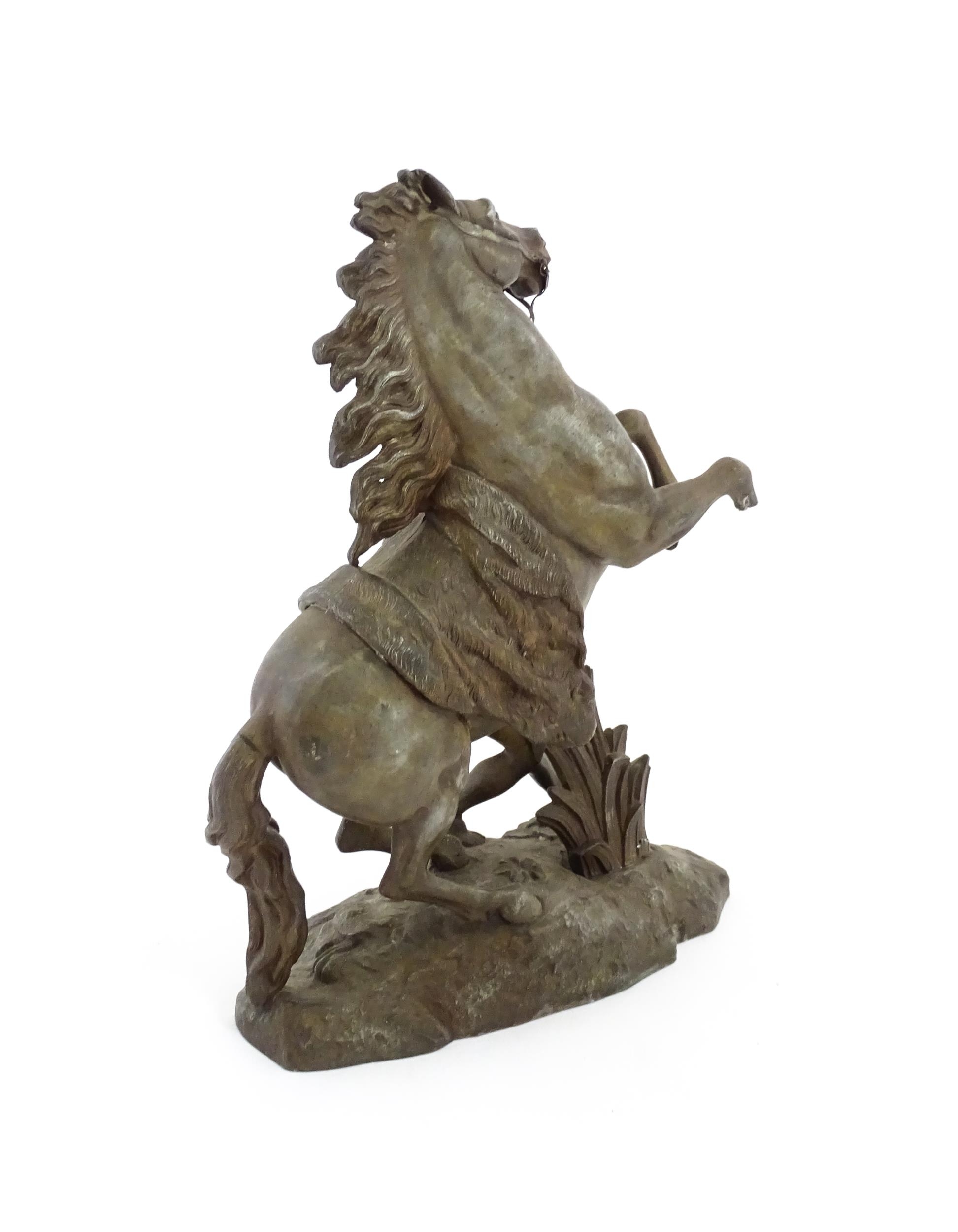 A 20thC cast Marly Horse modelled as a rearing horse with male attendant, after Guillaume Coustou I. - Image 7 of 8