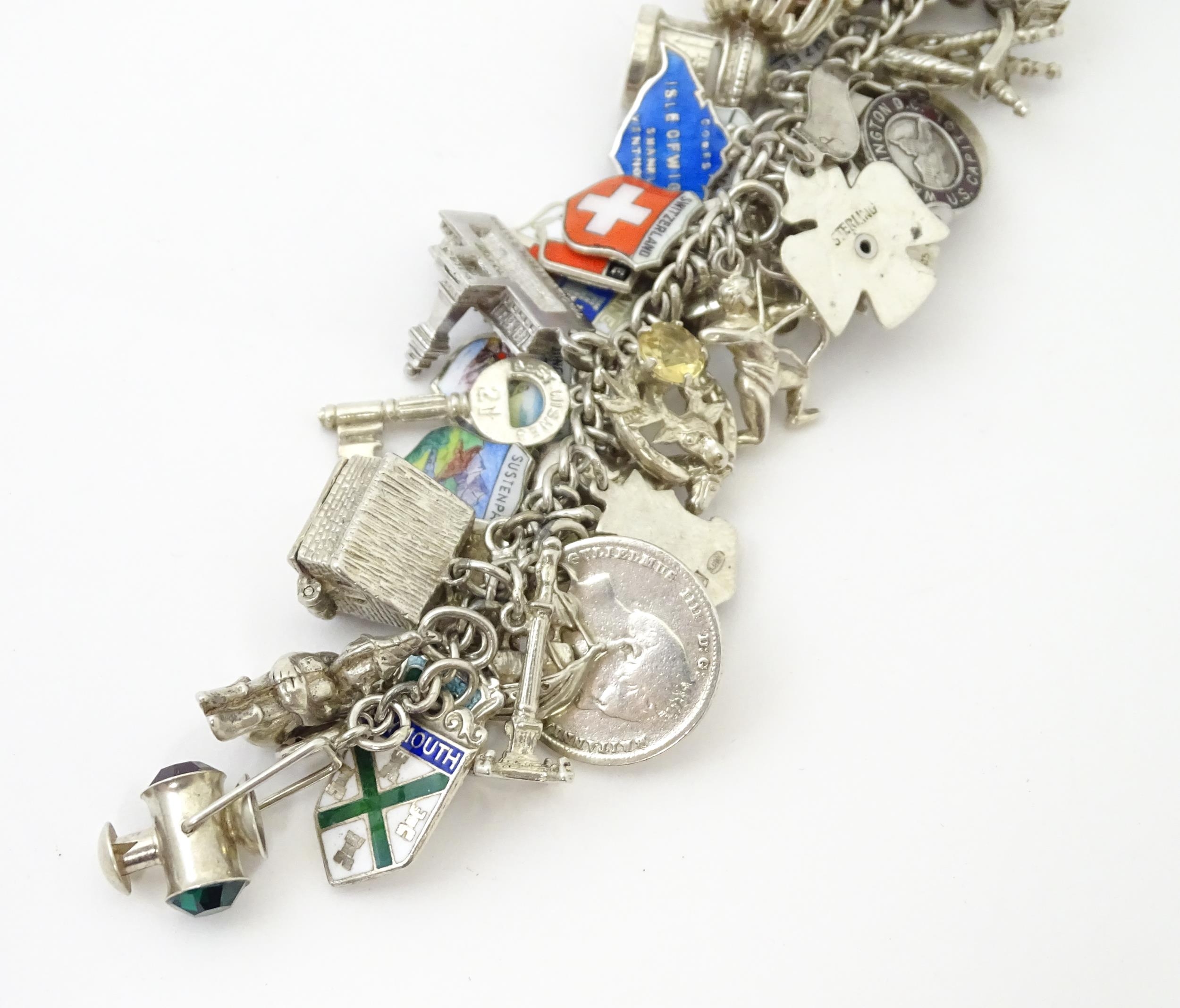 A silver charm bracelet set with various silver, white metal and silver plate charms Please Note - - Image 4 of 8